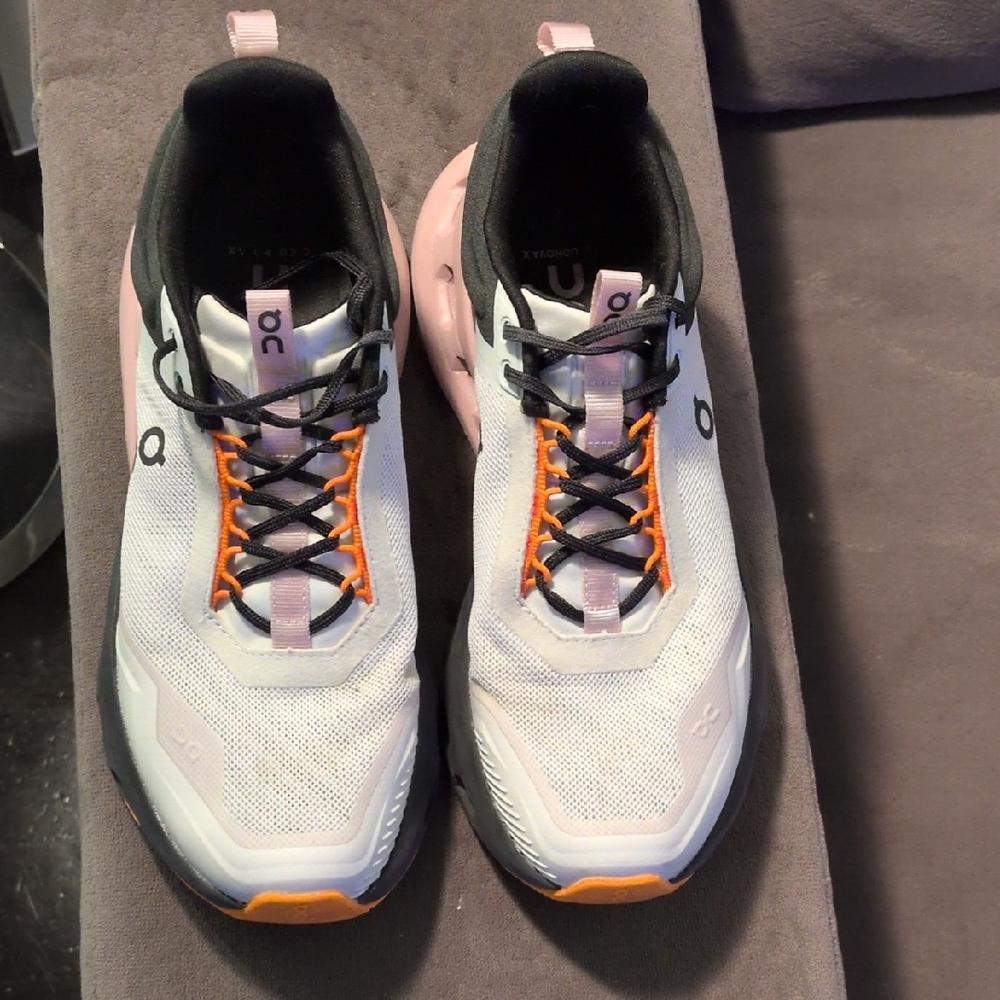 On Running Women's Athletic Shoes in White, Black, and Orange